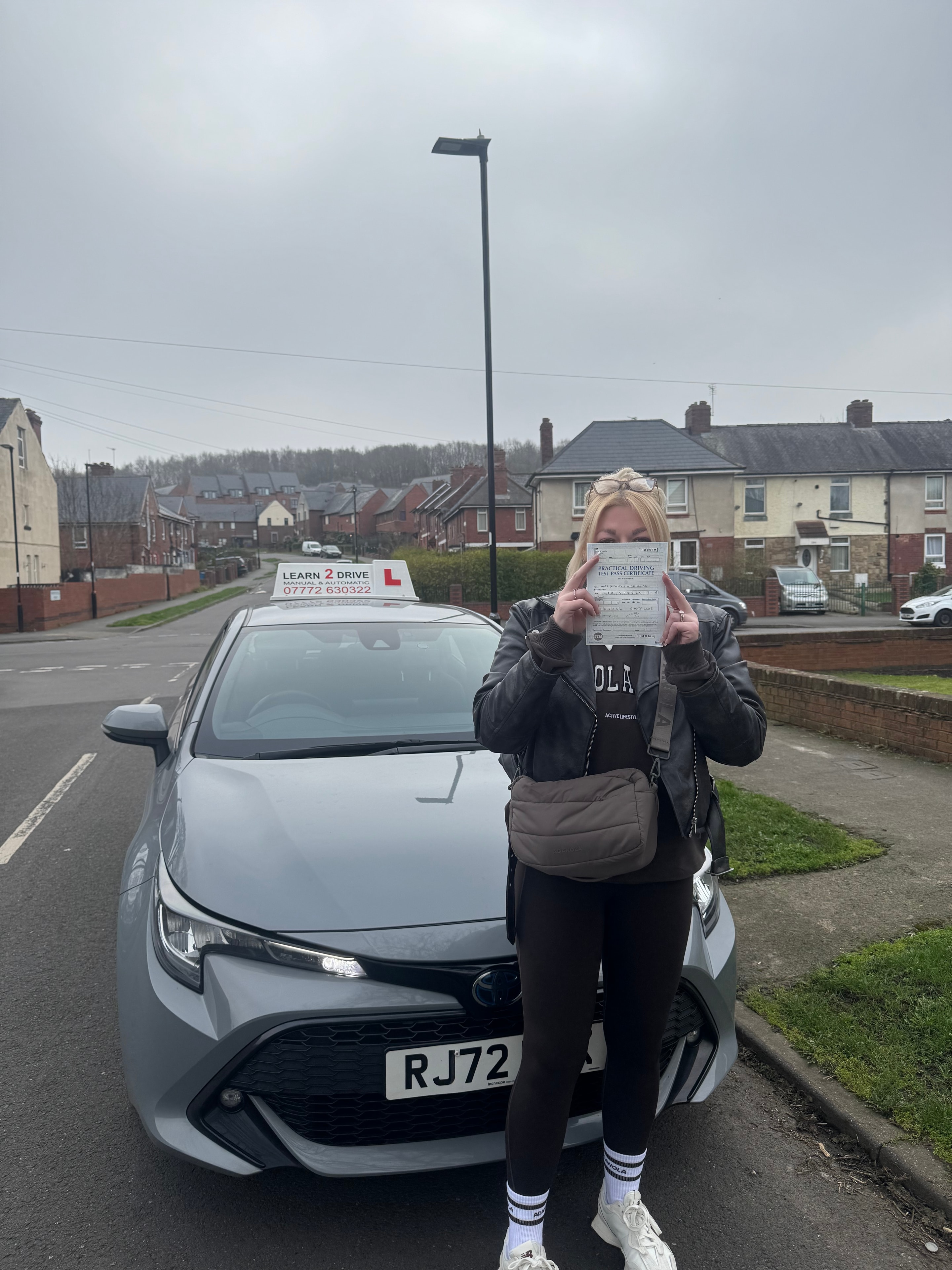 Student celebrating passing their driving test