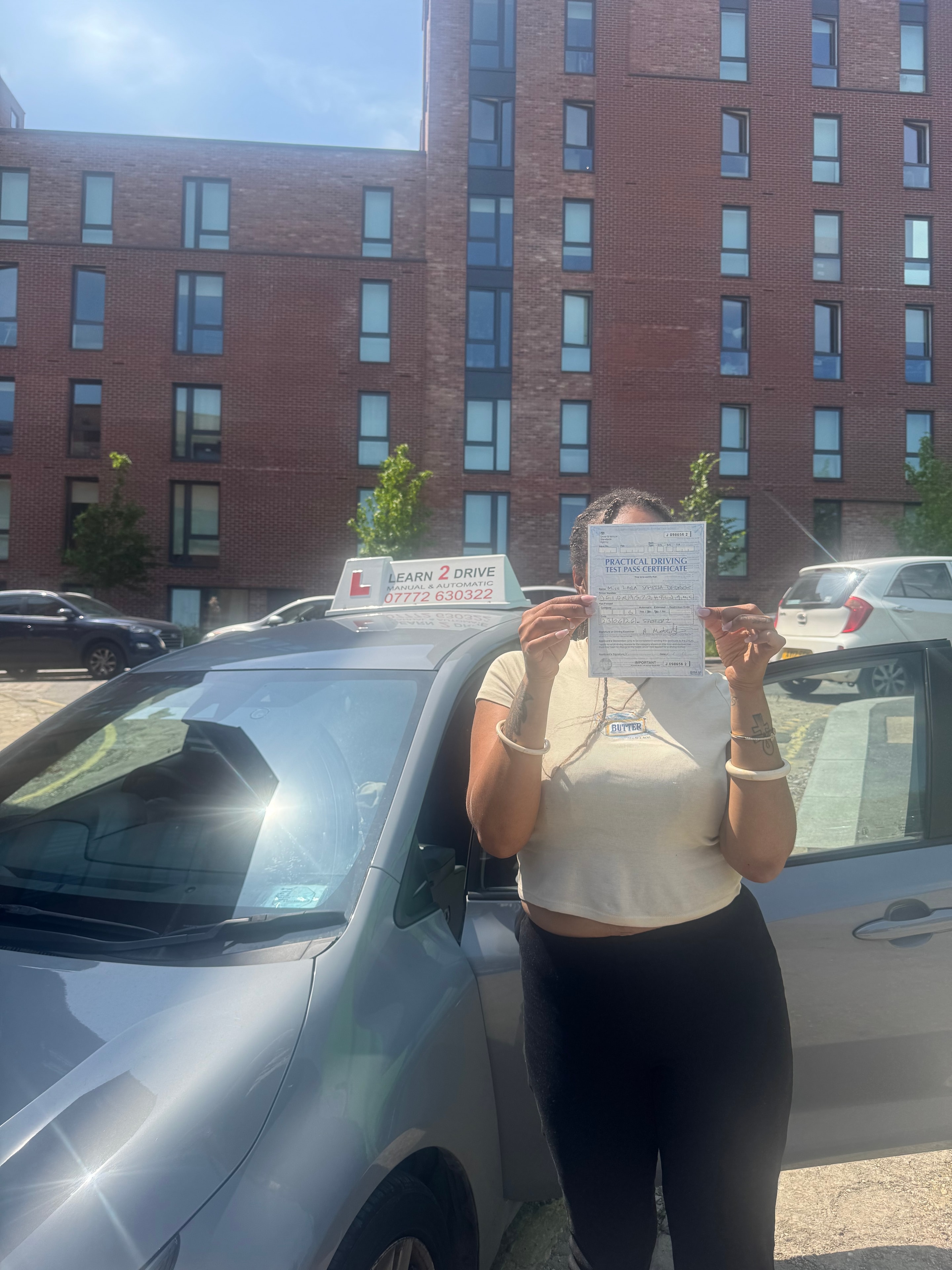 Student celebrating passing their driving test